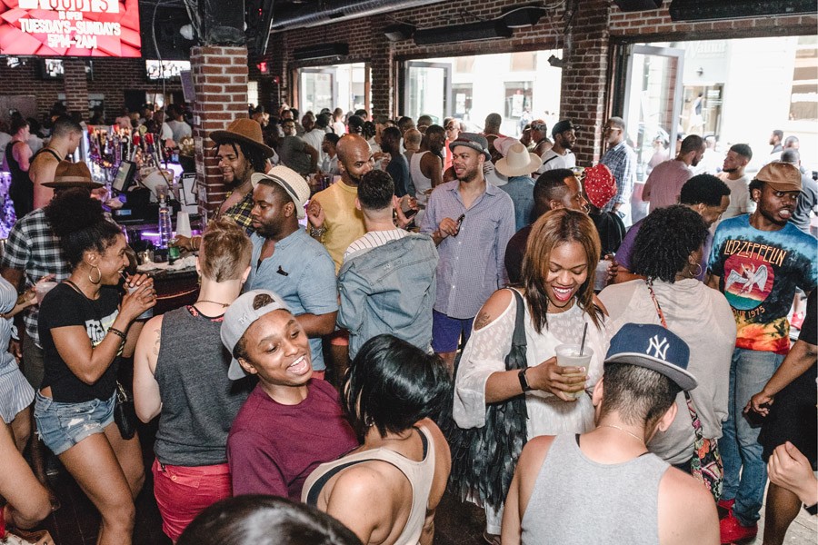 crowd partying at bar during philly black pride